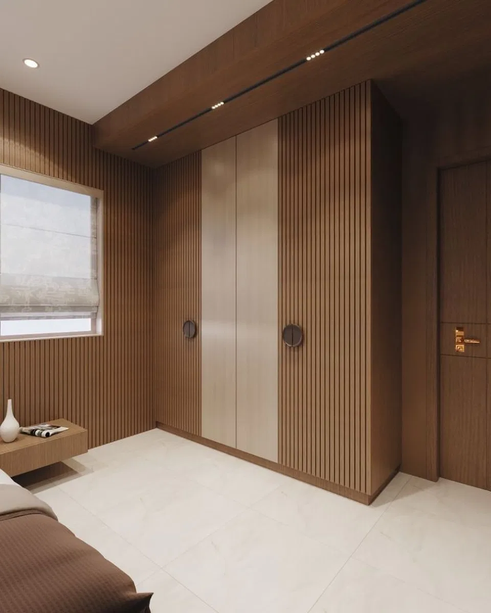 Minimalist bedroom with walnut brown fluted wall panels, beige wardrobe ...