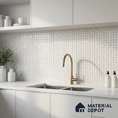Minimalist kitchen with frosty white laminate cabinets, white quartz countertop, and chevron patterned backsplash tile