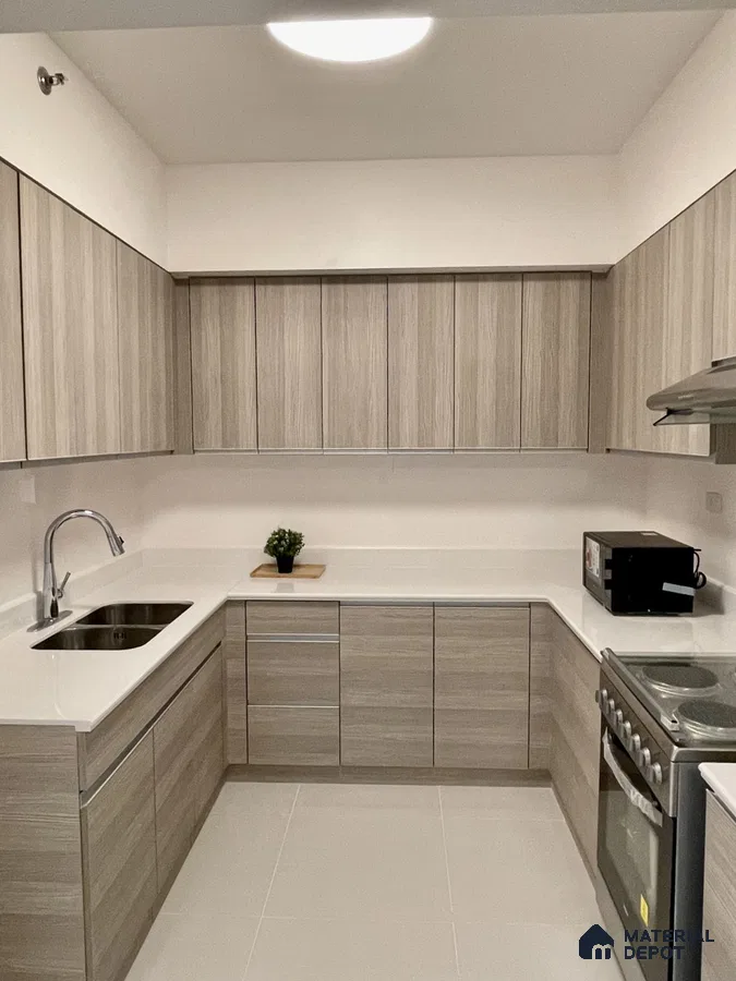 Minimalist kitchen with light oak wood grain laminate cabinets and white quartz countertop in Bengaluru | Material Depot