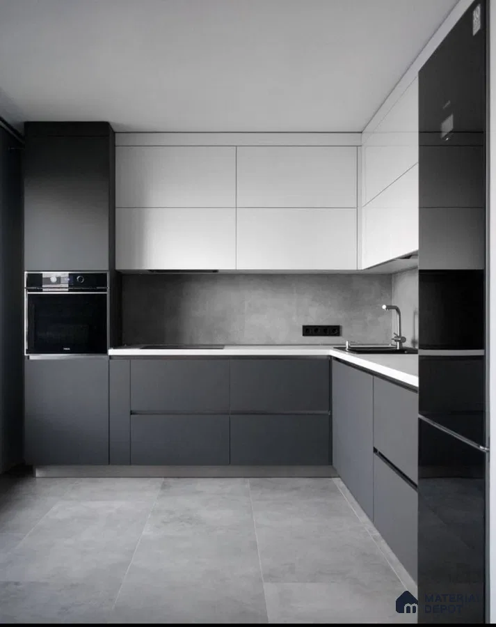 Minimalist kitchen with matte grey and white laminate, grey stone backsplash, and large format grey floor tiles in Bengaluru | Material Depot