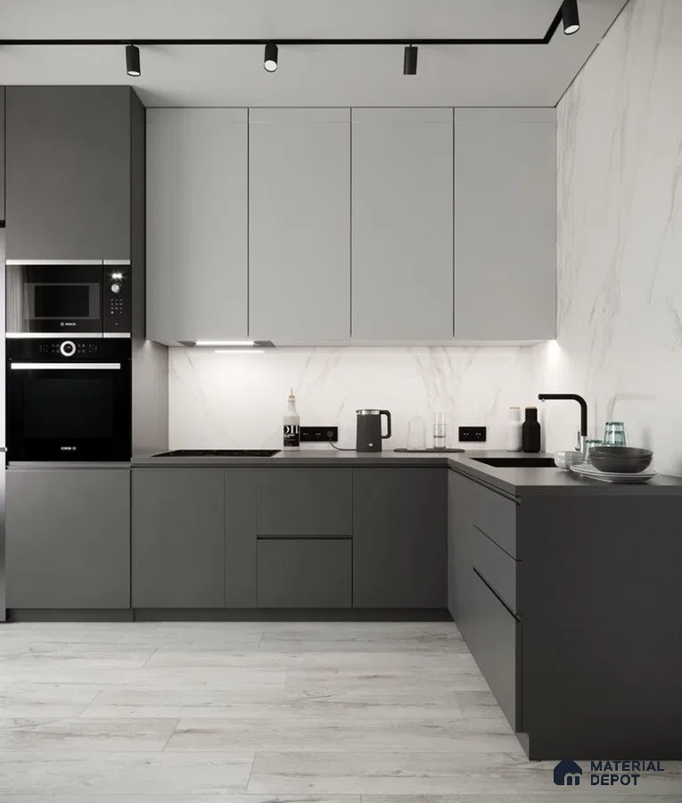 Minimalist kitchen with matte grey and white laminate, marble-look backsplash, and light wood floor tile in Bengaluru | Material Depot