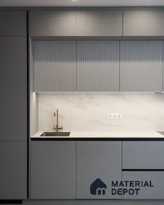 Minimalist kitchen with matte grey laminate, fluted upper cabinets, and white marble backsplash in Bengaluru | Material Depot