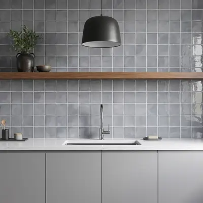 Minimalist kitchen with matte grey square wall tiles, white quartz countertop, and light grey laminate cabinets