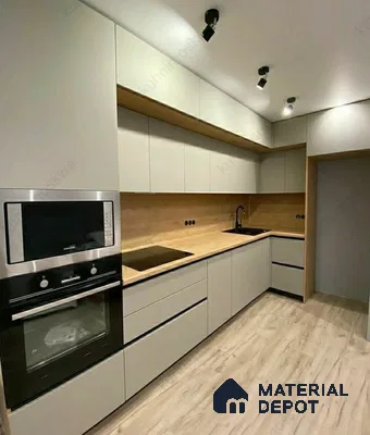 Minimalist kitchen with matte white laminate cabinets, light oak wood backsplash, and wood-look floor tile in Bengaluru | Material Depot