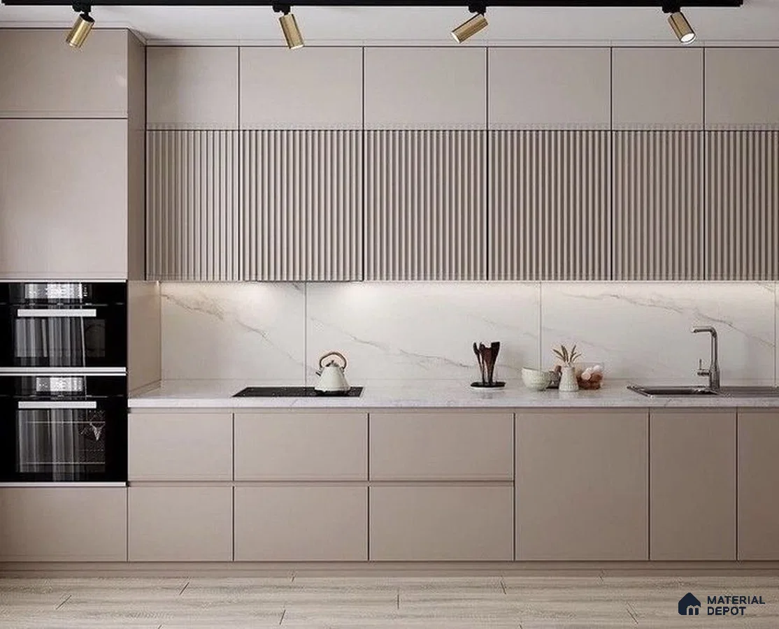 Minimalist kitchen with taupe matte laminate, fluted upper cabinets, and white marble backsplash in Bengaluru | Material Depot