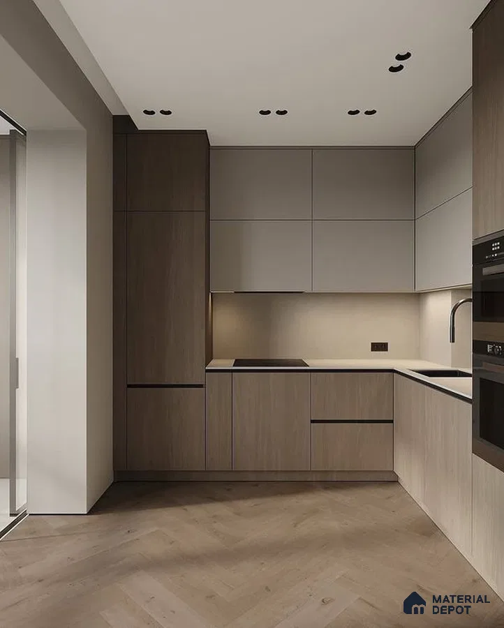 Minimalist kitchen with taupe wood laminate cabinets, matte beige laminate, and herringbone wood flooring in Bengaluru | Material Depot