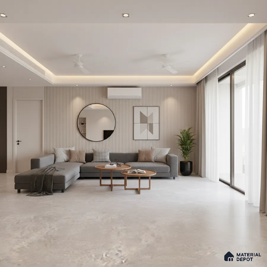 Minimalist living room with grey sectional, beige fluted wall panels, and light stone floor tiles in Bengaluru