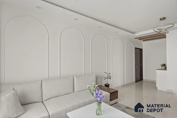 Minimalist living room with white arched wall mouldings and glossy beige floor tiles of 2 BHK in Purva Palm Beach Hennur Bengaluru | Material Depot