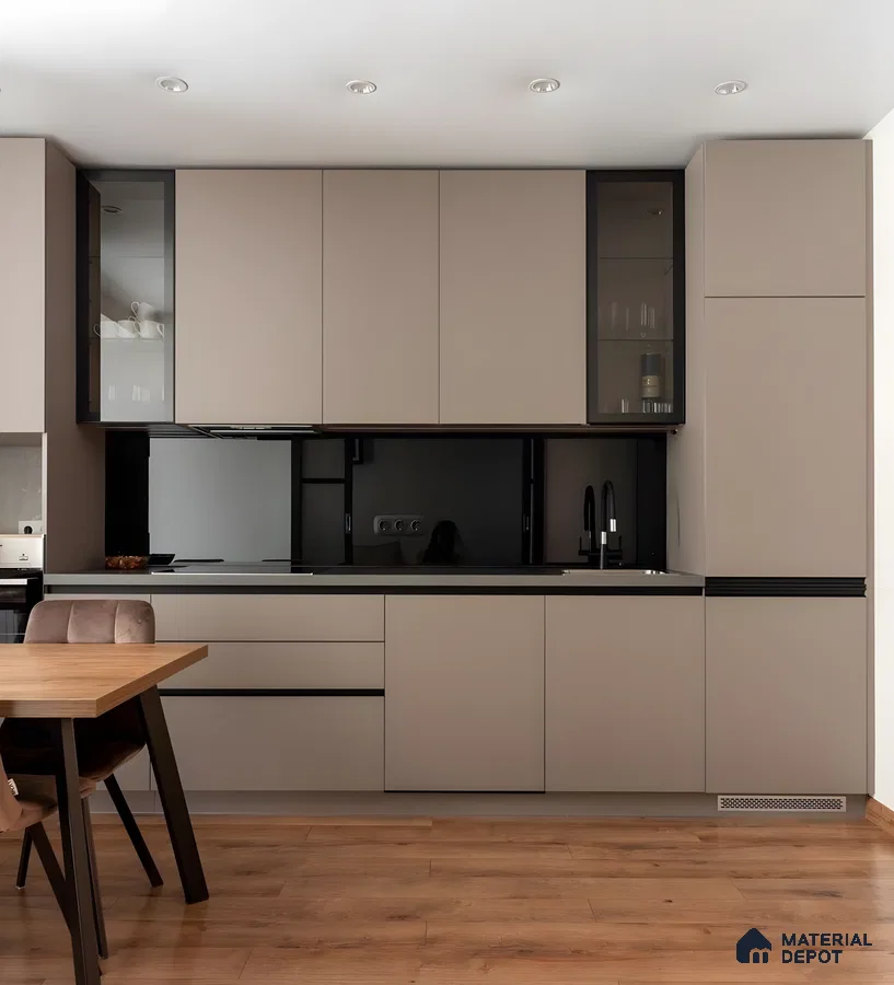 Minimalist Matte Taupe Modular Kitchen With Black Accents And Wood Flooring | Material Depot