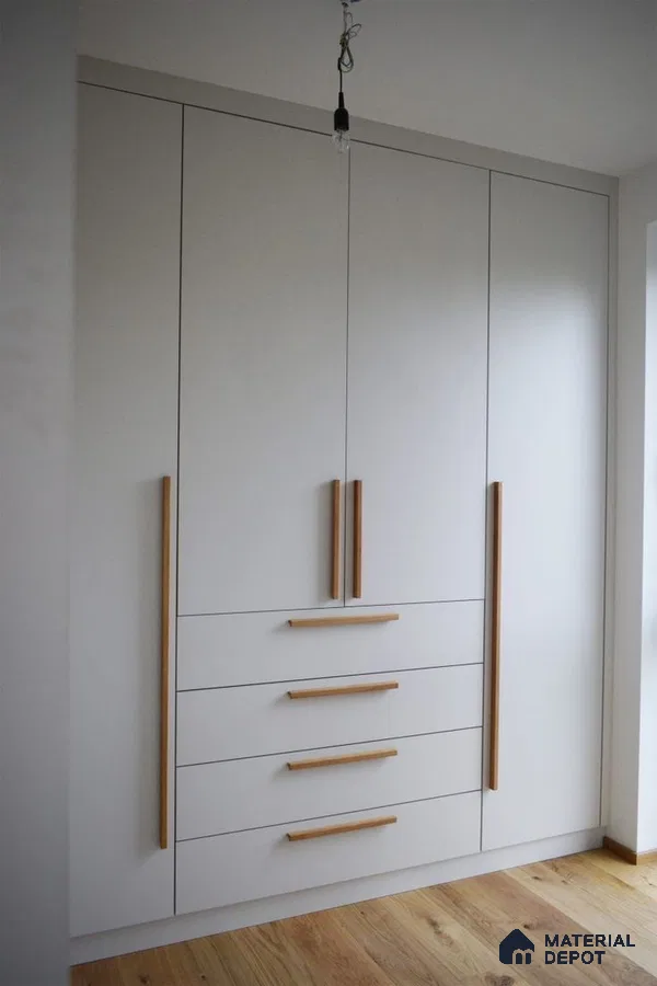 Minimalist wardrobe with frosty white laminate and natural oak handles on wooden flooring | Material Depot