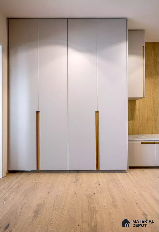 Minimalist wardrobe with frosty white laminate shutters and natural oak wooden flooring | Material Depot