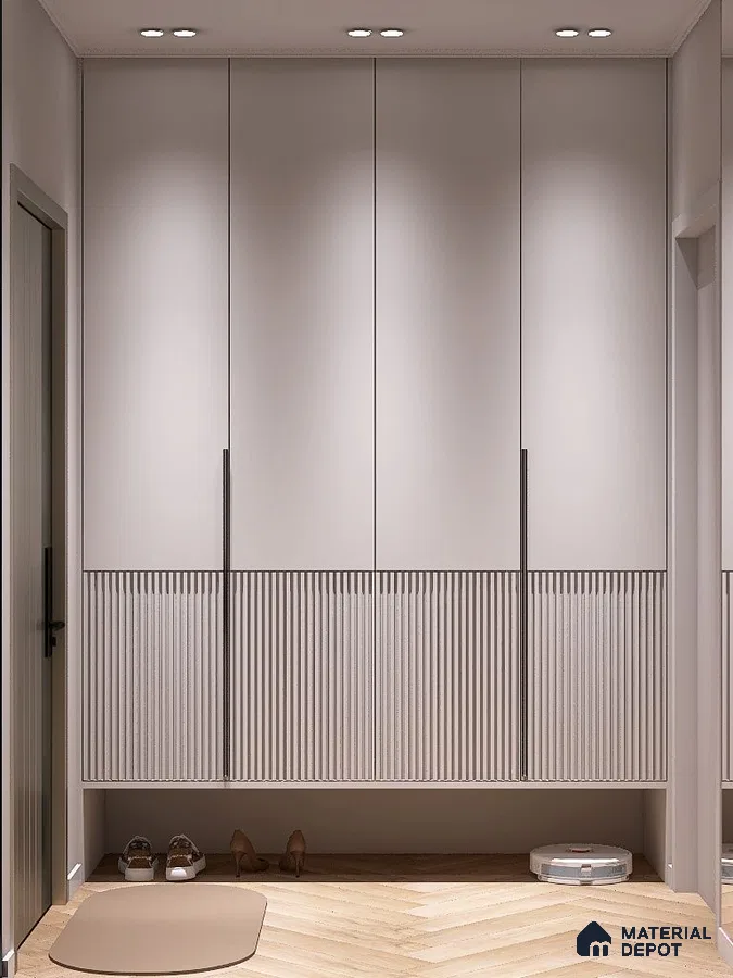 Minimalist Wardrobe with frosty white solid and fluted laminate cabinets and light oak herringbone wooden flooring | Material Depot