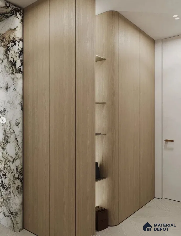 Minimalist Wardrobe with light oak laminate panels and dramatic marble accent wall | Material Depot