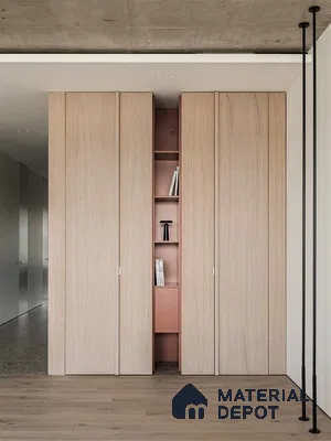 Minimalist wardrobe with light oak laminate shutters and blush pink open shelving | Material Depot