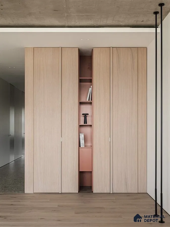 Minimalist wardrobe with light oak laminate shutters and blush pink open shelving | Material Depot