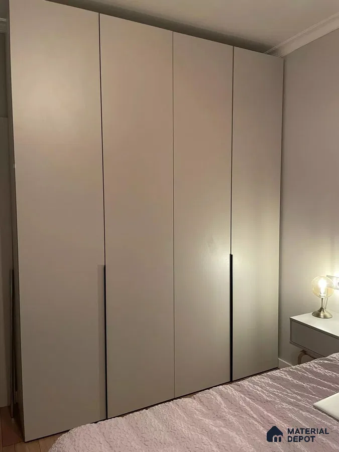 Minimalist wardrobe with matte beige laminate shutters in bedroom | Material Depot