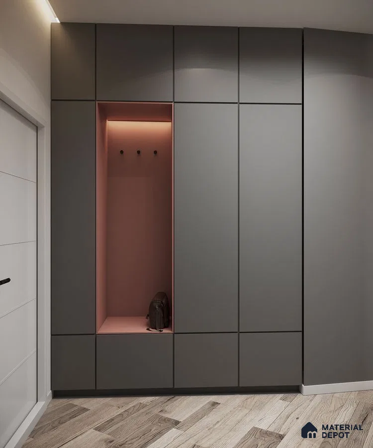 Minimalist Wardrobe with matte grey laminate cabinets, blush pink accent niche, and light oak wood flooring | Material Depot