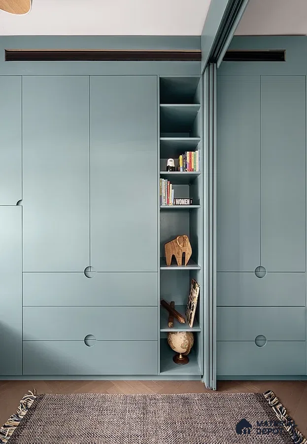 Minimalist wardrobe with matte pastel blue laminate and integrated open shelving | Material Depot
