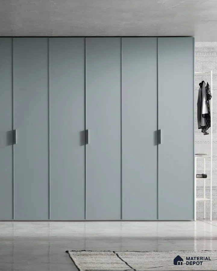 Minimalist wardrobe with matte pastel blue laminate shutters and concrete floor | Material Depot