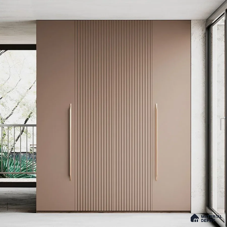 Minimalist wardrobe with matte taupe fluted laminate shutters and long gold handles | Material Depot