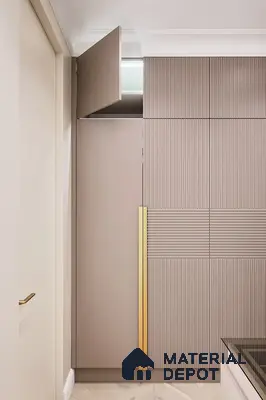Minimalist wardrobe with taupe fluted laminate and gold accent handle | Material Depot