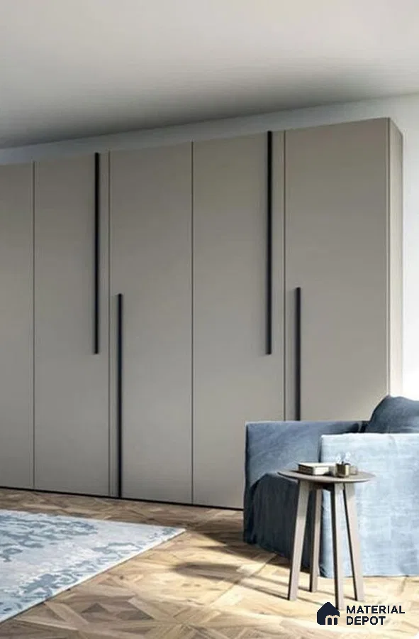 Minimalist wardrobe with taupe matte laminate shutters and herringbone wood flooring | Material Depot
