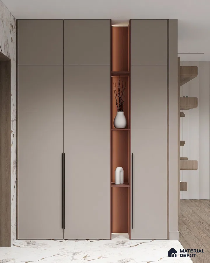 Minimalist wardrobe with taupe matte laminate shutters and terracotta open shelving on marble floor | Material Depot