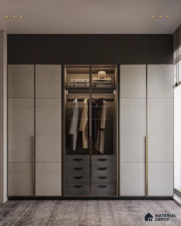 Minimalist wardrobe with textured beige laminate shutters and dark fluted panel accent | Material Depot