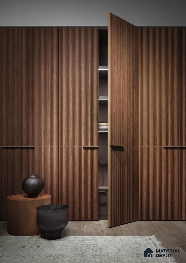 Minimalist wardrobe with walnut brown fluted laminate shutters and wood flooring | Material Depot