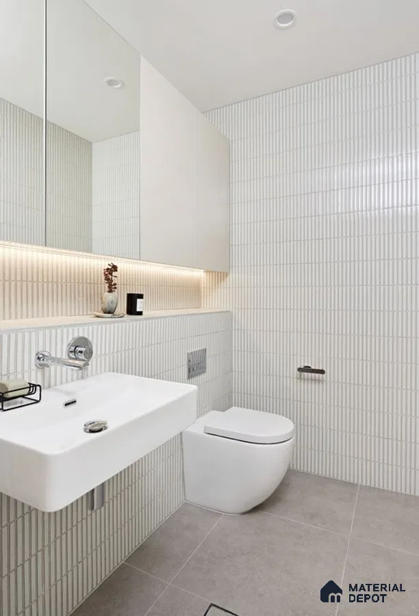 Minimalist White Bathroom with Vertical Tile Accents and Floating Fixtures | Material Depot