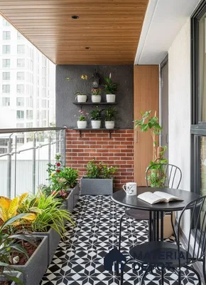 Modern balcony with geometric black-and-white floor tiles, brick cladding, and wood ceiling panels in Prestige Kew Gardens Bellandur 3 BHK Bengaluru Apartment