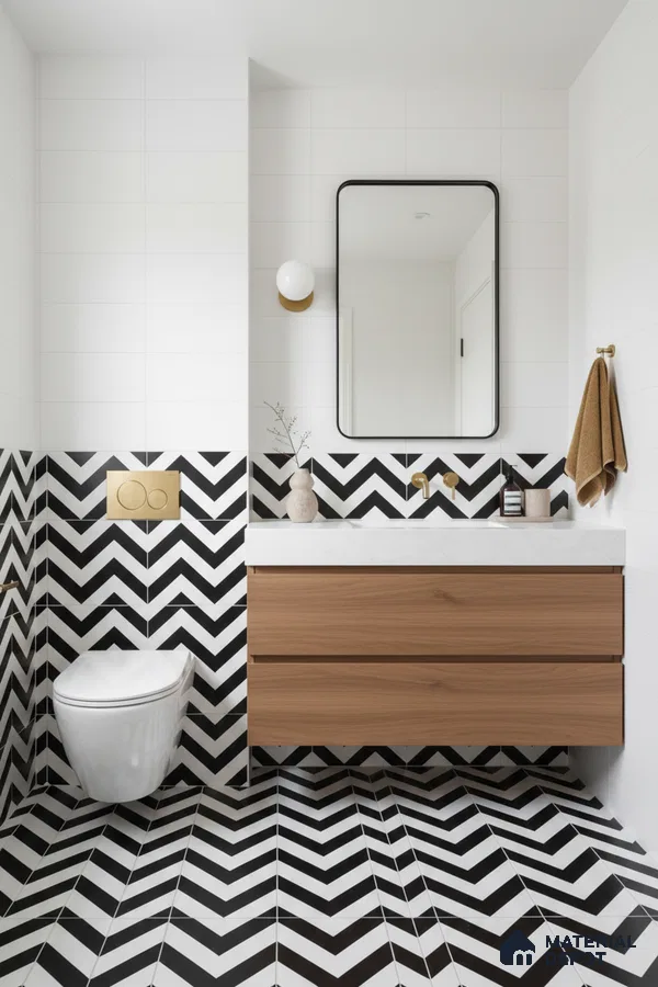 Modern bathroom with black-and-white chevron tiles, white wall tiles, and wood laminate vanity in Bengaluru | Material Depot