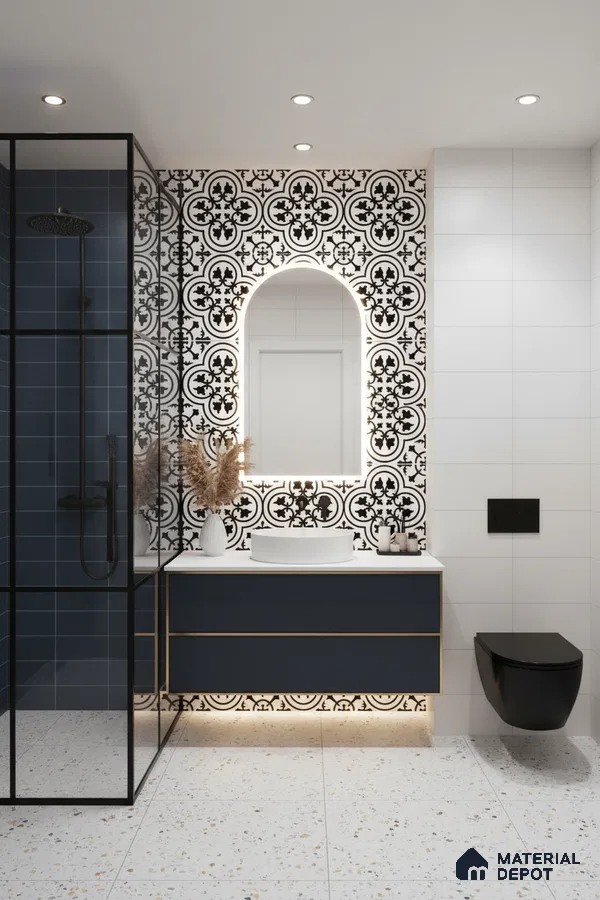 Modern bathroom with black-and-white patterned wall tiles, navy blue vanity, terrazzo floor tiles in Bengaluru | Material Depot