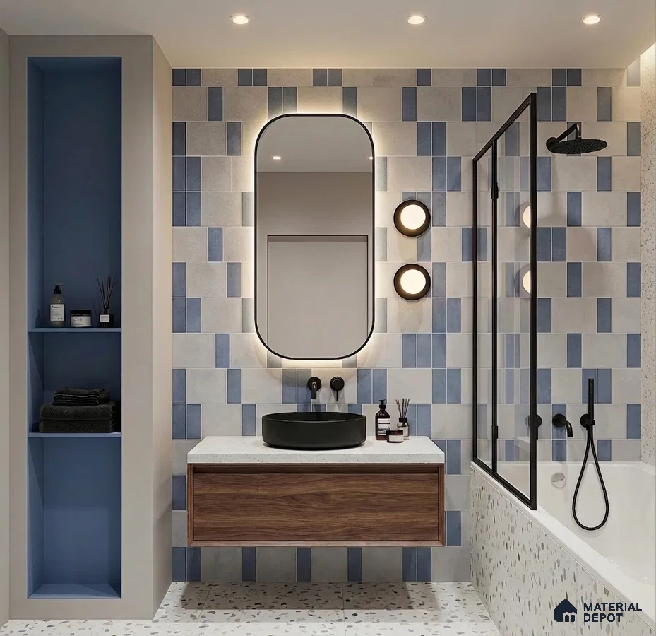 Modern bathroom with blue and white geometric wall tiles, terrazzo floor, and walnut floating vanity