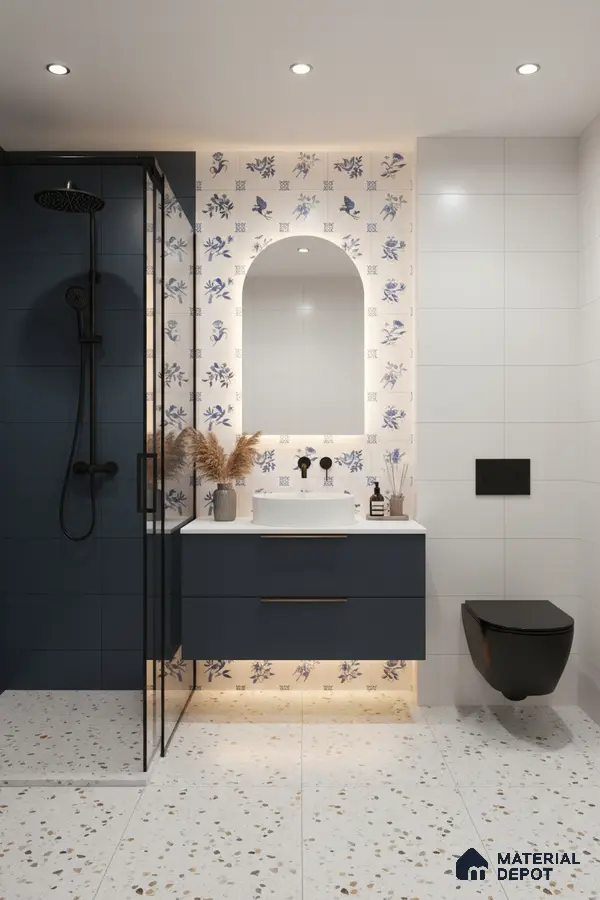 Modern bathroom with blue floral accent wall tiles, terrazzo floor tiles, and navy vanity in Bengaluru | Material Depot