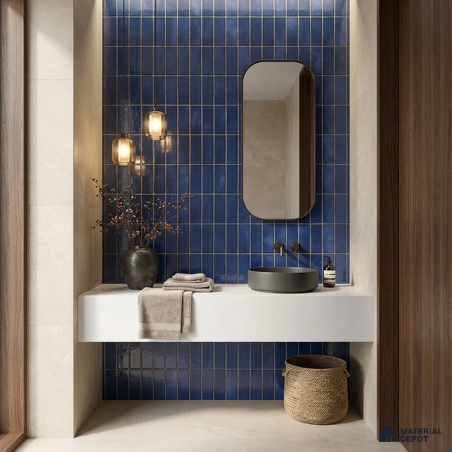Modern bathroom with blue vertical subway wall tiles and white quartz countertop