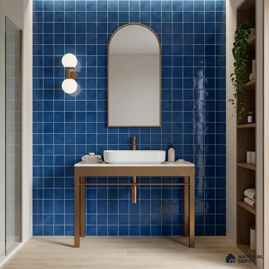 Modern bathroom with cobalt blue square wall tiles and light wood floor