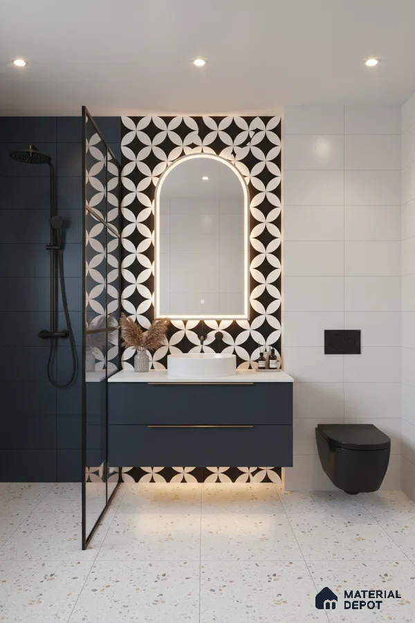Modern bathroom with geometric black-and-white accent wall tile, terrazzo floor tile, and matte navy vanity in Bengaluru | Material Depot