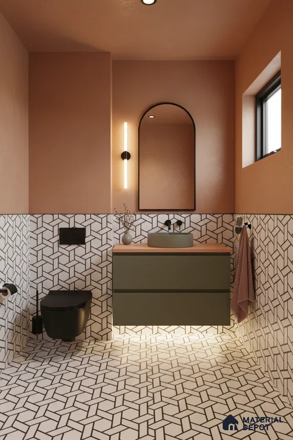 Modern bathroom with geometric black-and-white wall and floor tiles, olive green vanity, and terracotta wall paint in Bengaluru | Material Depot