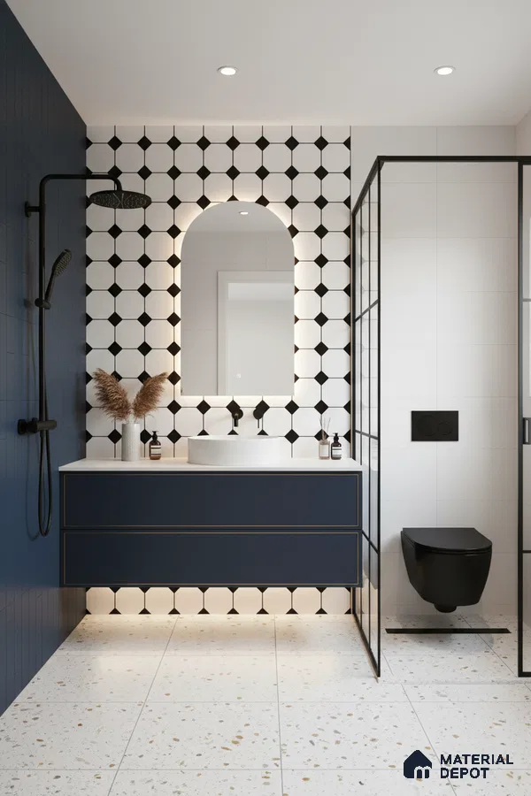 Modern bathroom with geometric black-and-white wall tiles, terrazzo floor tiles, and navy blue floating vanity in Bengaluru | Material Depot