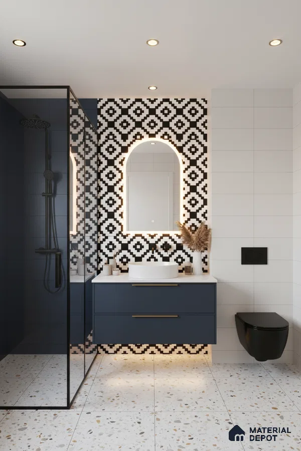Modern bathroom with geometric black-and-white wall tiles, terrazzo floor tiles, and navy blue vanity in Bengaluru | Material Depot