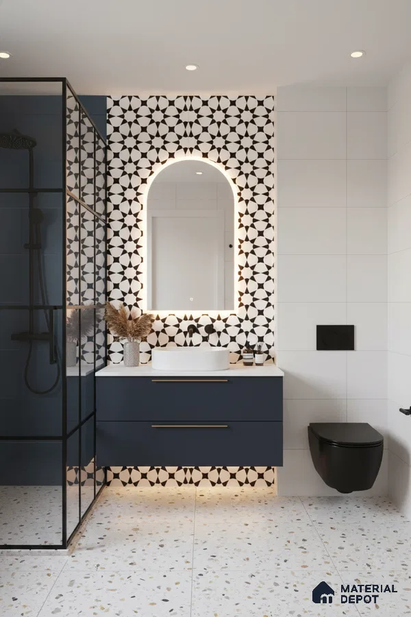 Modern bathroom with geometric black-and-white wall tiles, terrazzo floor tiles, and navy floating vanity in Bengaluru | Material Depot