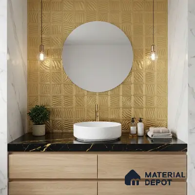 Modern bathroom with gold textured wall tiles, black marble countertop, and light oak vanity