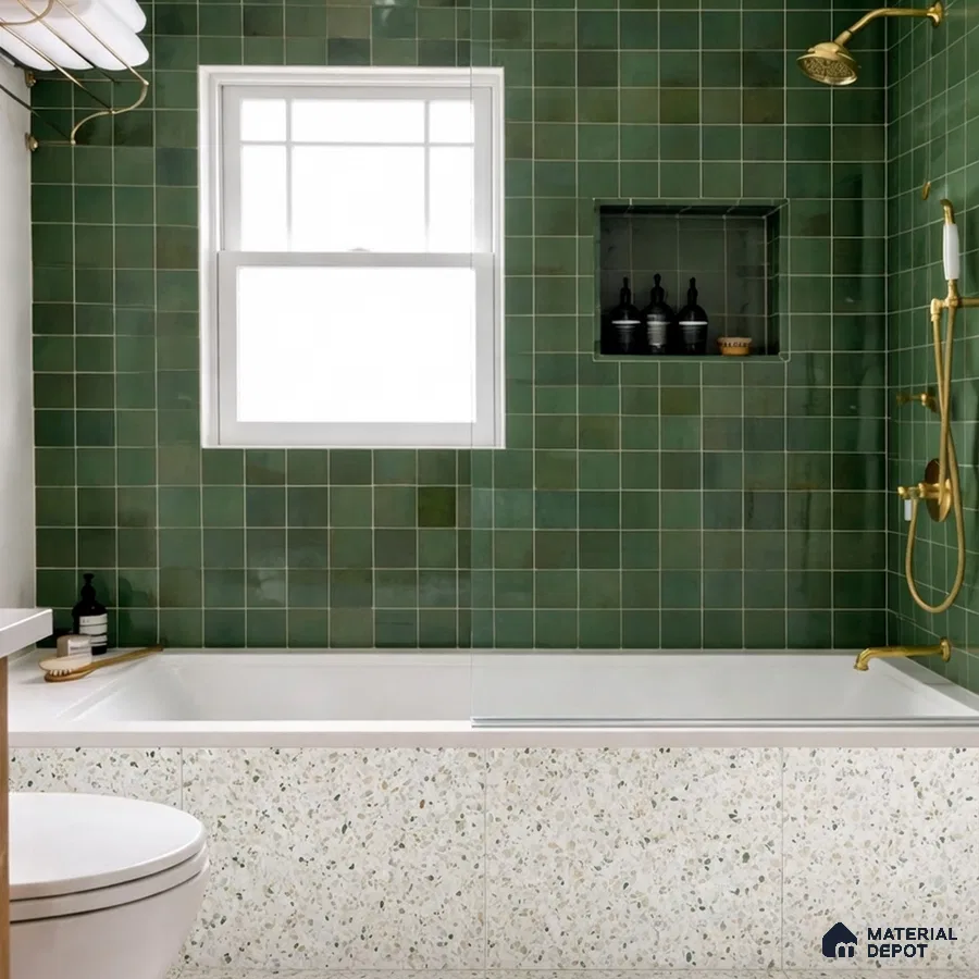 Modern bathroom with green square wall tiles and terrazzo bathtub cladding