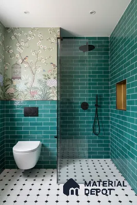 Modern bathroom with green subway wall tiles, floral wallpaper, and black-and-white geometric floor tiles | Material Depot