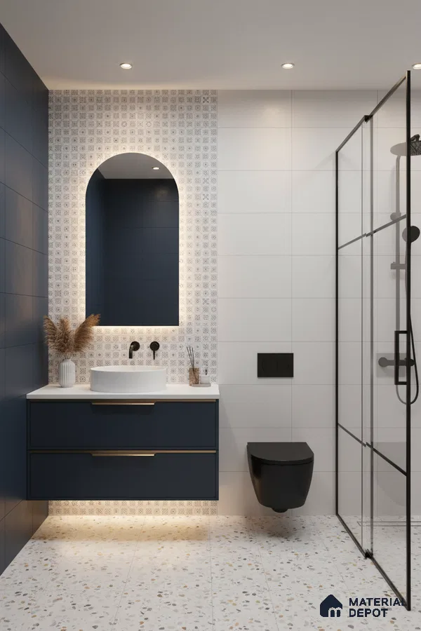 Modern bathroom with navy blue vanity, terrazzo floor tiles, and patterned accent wall tiles in Bengaluru | Material Depot