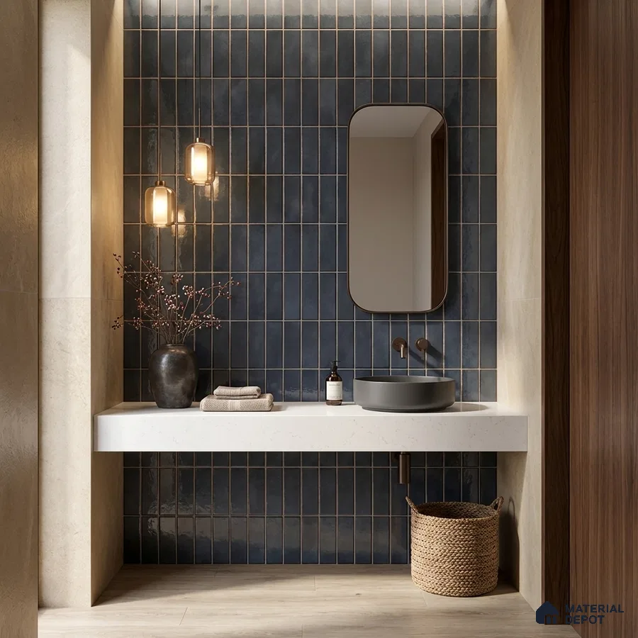 Modern bathroom with navy blue vertical subway wall tiles and white quartz countertop