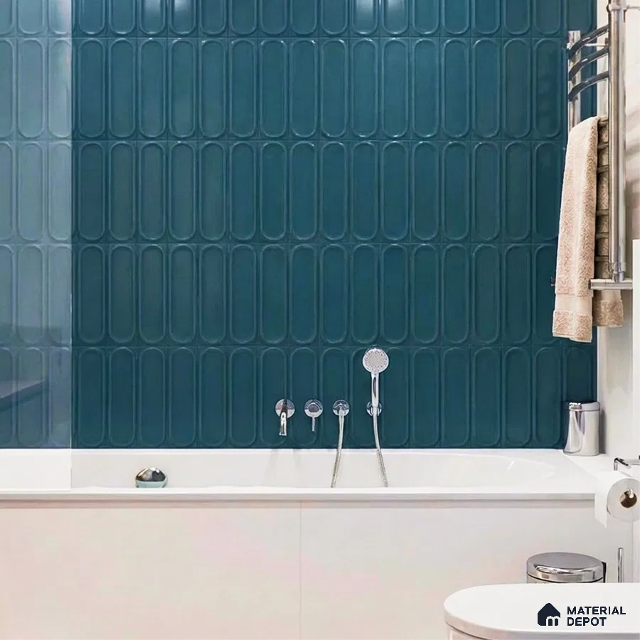 Modern bathroom with teal elongated subway wall tiles and white bathtub