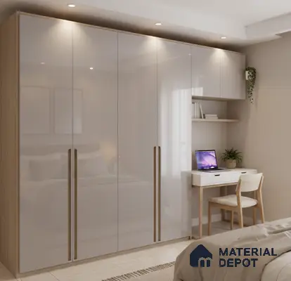 Modern bedroom with high gloss beige wardrobe and light wood study desk in Bengaluru