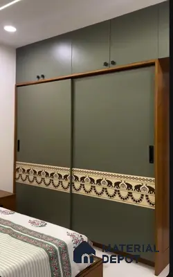Modern bedroom with olive green solid color laminate wardrobe and Indian motif accent panel | Material Depot